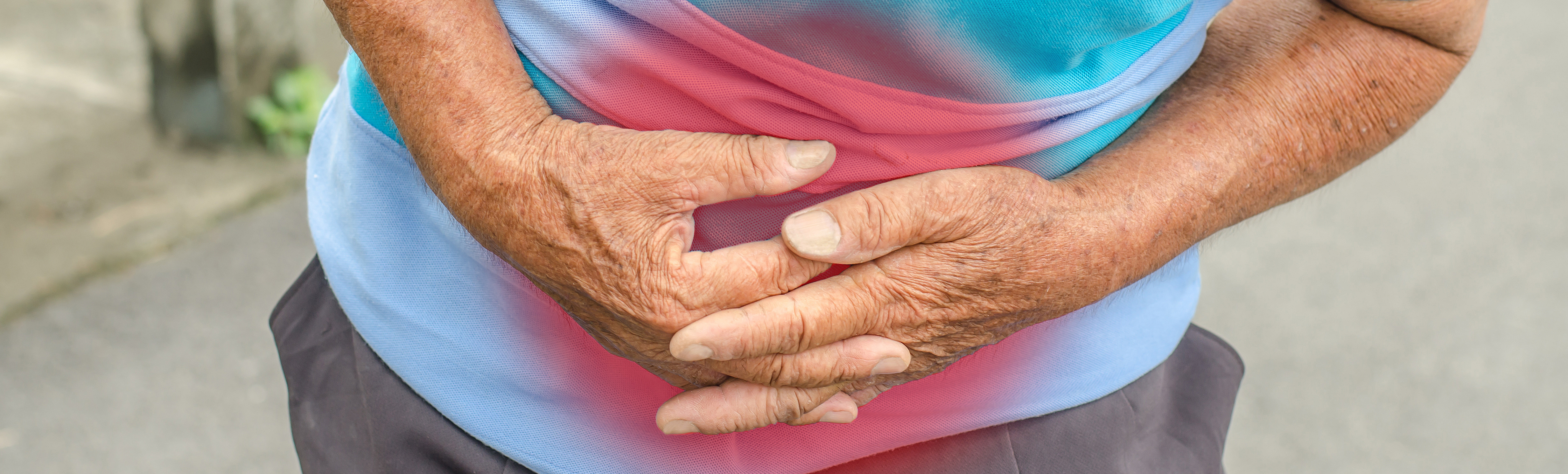 Mature man overwhelmed with a pain in the stomach from constipation