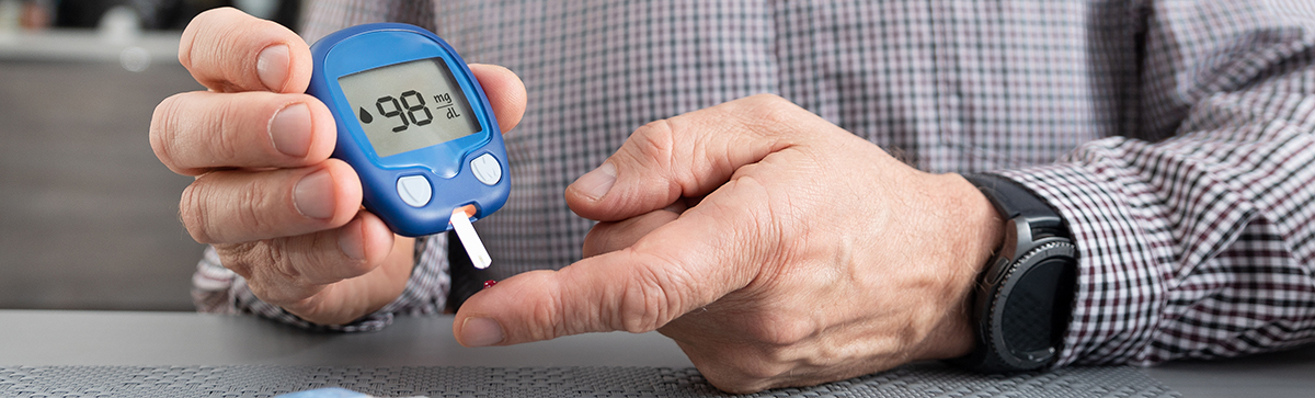 Man testing blood sugar