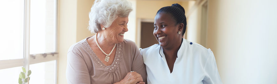 Nurse walking with resident