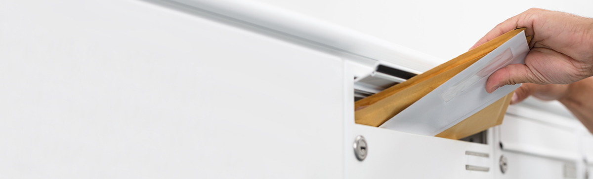 putting mail in mailbox slot