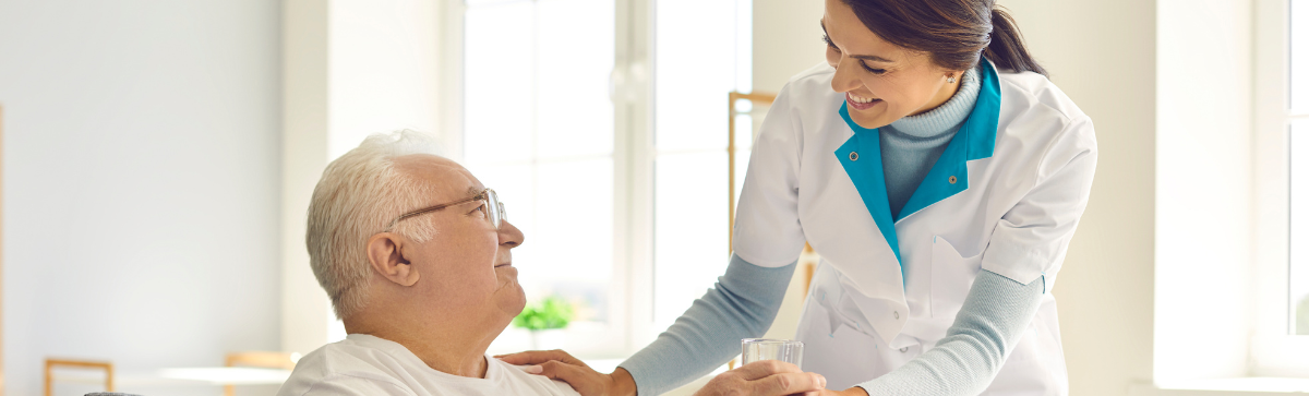 Nursing rounding and caring for senior resident.