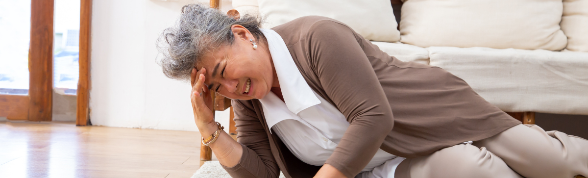 Woman on the floor after a fall experiencing a stroke.