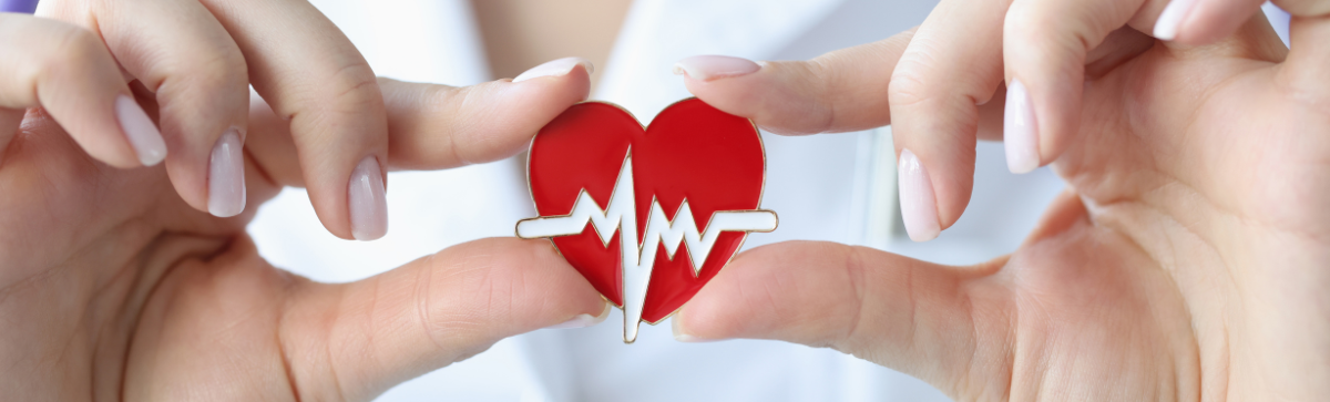 caregiver holding a heart pin