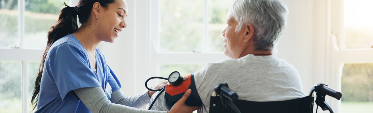 elderly woman having her blood pressure checked